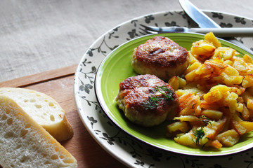 Russian cuisine. Homemade meatballs and fried potatoes. Home-cooked lunch.