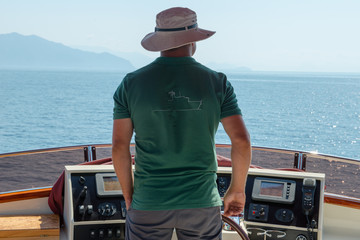 skipper driving a yacht on the sea