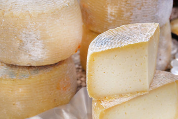 Homemade fresh and healthy cheese in farmers' market. Concept of biological and genuine cheese.