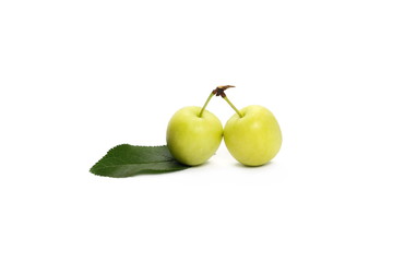Green plums with leaf isolated on white background