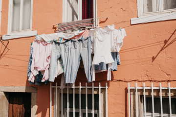 Authentic photography. Clothes dry on the facade of an apartment building in Lisbon in Portugal....