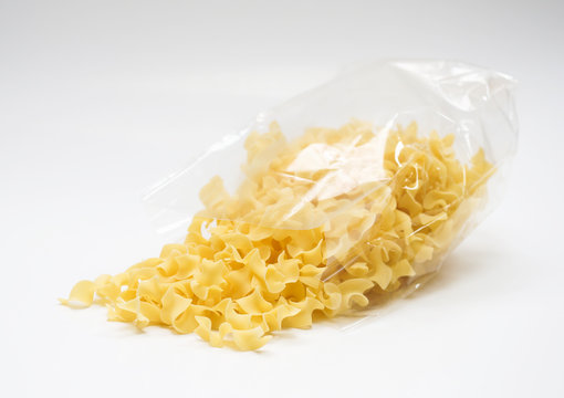 Transparent plastic pasta bag "tagliatelle girate." on white background