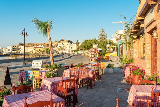 Tavernas, shops and stores at the seaside promenade of the small town. Tourism is a main factor of economy in town