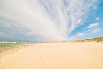 View of the dunes in Nida, Lithuania. A popular destination in Europe in Lithuania. Beaches and huge dunes covering the end of the Curonian Spit are included in the UNESCO World Heritage Site
