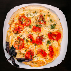 European international fusion cuisine, a beautiful dish on a white plate decorated with herbs and...
