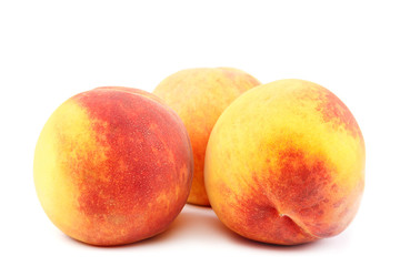 Fresh peach fruits isolated on white background