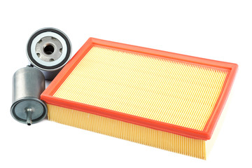 Automobile air, oil and fuel filter on white background