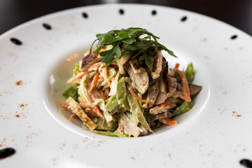 European international fusion cuisine, a beautiful dish on a white plate decorated with herbs and vegetables. a professional chef has prepared a delicious meal.