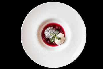 European international fusion cuisine, a beautiful dish on a white plate decorated with herbs and...