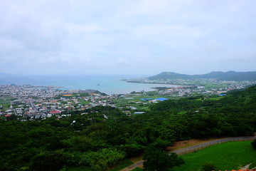 Fototapeta premium Beautiful sunny day blue sky and white cloud view with fresh green tree and grass travel in Japan Okinawa