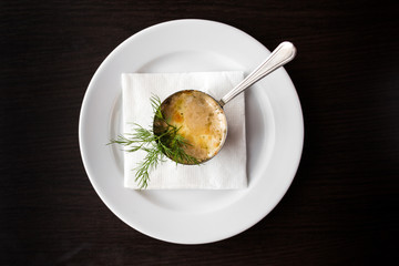 European international fusion cuisine, a beautiful dish on a white plate decorated with herbs and vegetables. a professional chef has prepared a delicious meal.