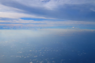 Beautiful blue sky and white cloud and landscape view from the plane in Japan Okinawa