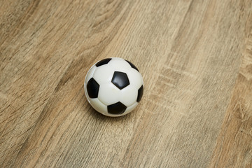 Soccer ball on the wooden floor