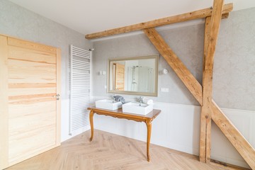 White wash basins in loft bathroom.