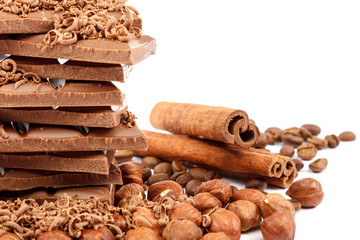Chocolate tiles and nuts on white background