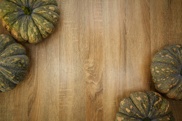 Fototapeta premium Pumpkins against a rustic