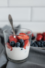 Healthy yogurt for breakfast with blueberries and strawberries