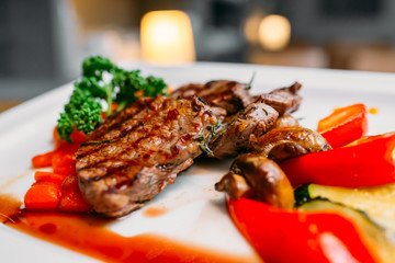 European international fusion cuisine, a beautiful dish on a white plate decorated with herbs and...