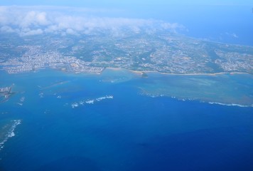 Beautiful blue sky and white cloud and landscape view from the plane in Japan Okinawa