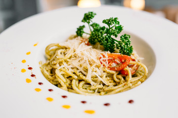 European international fusion cuisine, a beautiful dish on a white plate decorated with herbs and vegetables. a professional chef has prepared a delicious meal.