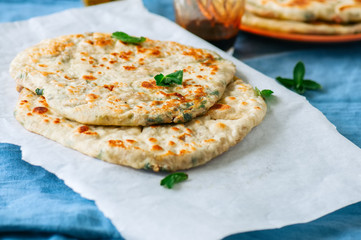 Indian flatbread - Herb stuffed paratha on a baking paper