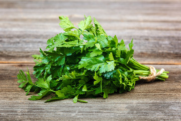 Parsley green fresh on a wooden background