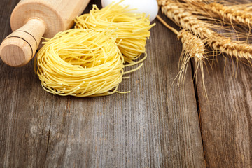 Pasta vermicelli eggs kitchen accessories on a wooden