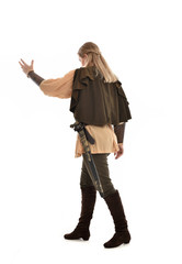 Fototapeta premium full length portrait of girl wearing medieval costume with sword. standing pose with back to the camera, isolated on white studio background.