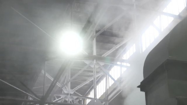 Hot steam on sugar refinery plant indoors