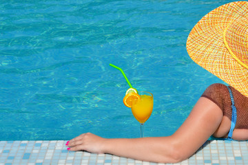 Real female beauty relaxing in swimming pool