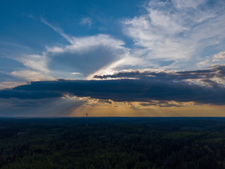 Aerial view of the sunset over the lake and forest 