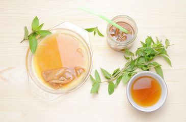 Fresh home made Kombucha fermented tea on a wooden background