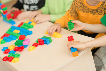 kids playing with puzzle, education concept