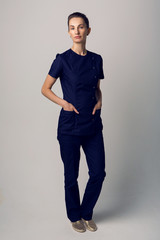 doctor beautician in a blue robe is in the Studio