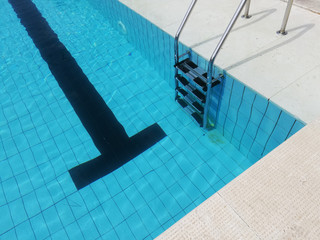 blue swimming pool staircase