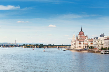 Fototapeta na wymiar a classic view of the famous tourist attraction of Budapest - the Hungarian Parliament and the Danube River with ships