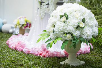 White flower on vase wedding decoration in the garden