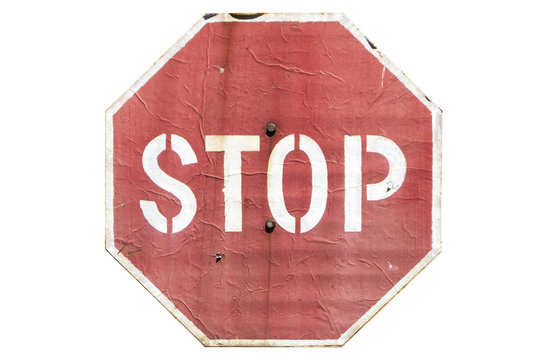 Old paper on metal road sign 'Stop' isolated on white