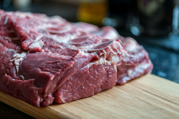 Raw meat on a chopping board. Close- up
