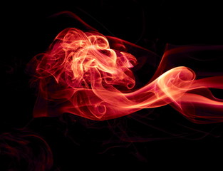 Red smoke on black background