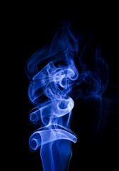 Blue smoke on black background