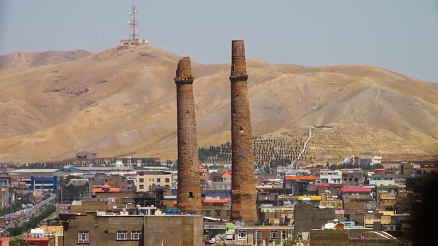 A steady shot of the tall ancient minarets in Heret.