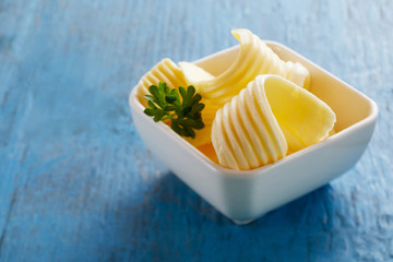 Small ceramic dish with butter curls