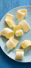 Freshly prepared fancy butter curls on a plate