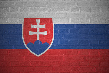 Flag of Slovakia on brick wall background, 3d illustration