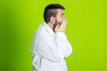 Frightened man stood with a frightened look on his face