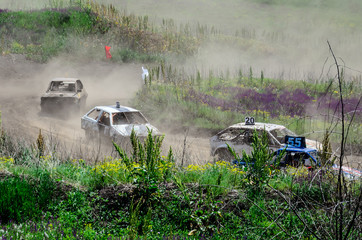 Race of the old wrecked cars. Rally on the open air with dust
