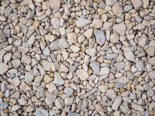 Pile of stones on the construction site. A layer of stone lining under the asphalt.