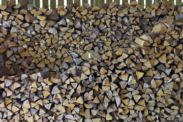 Firewood stack in woodshed.