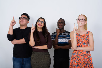 Studio shot of happy diverse group of multi ethnic friends smili